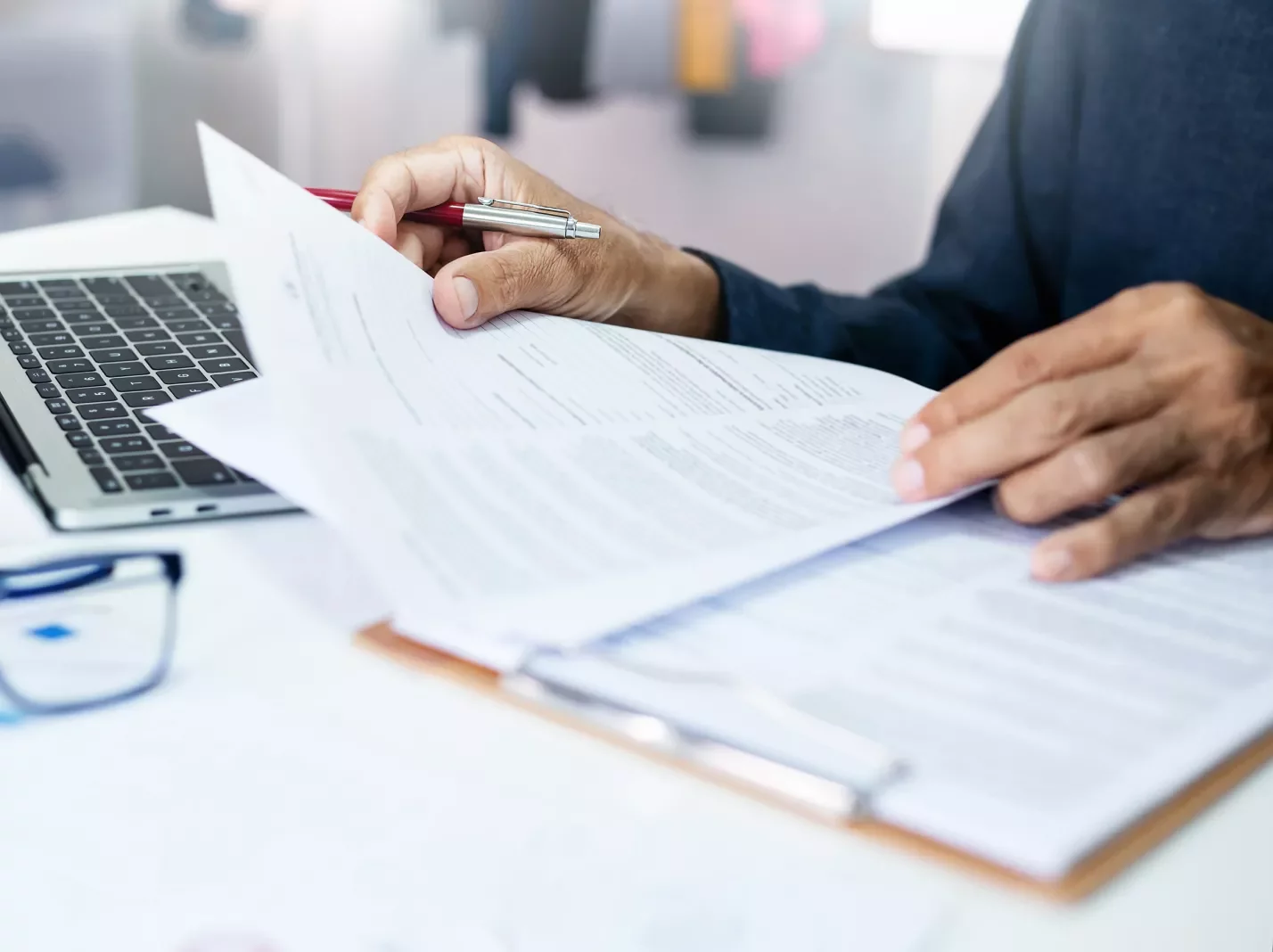 Hands with paperwork document review