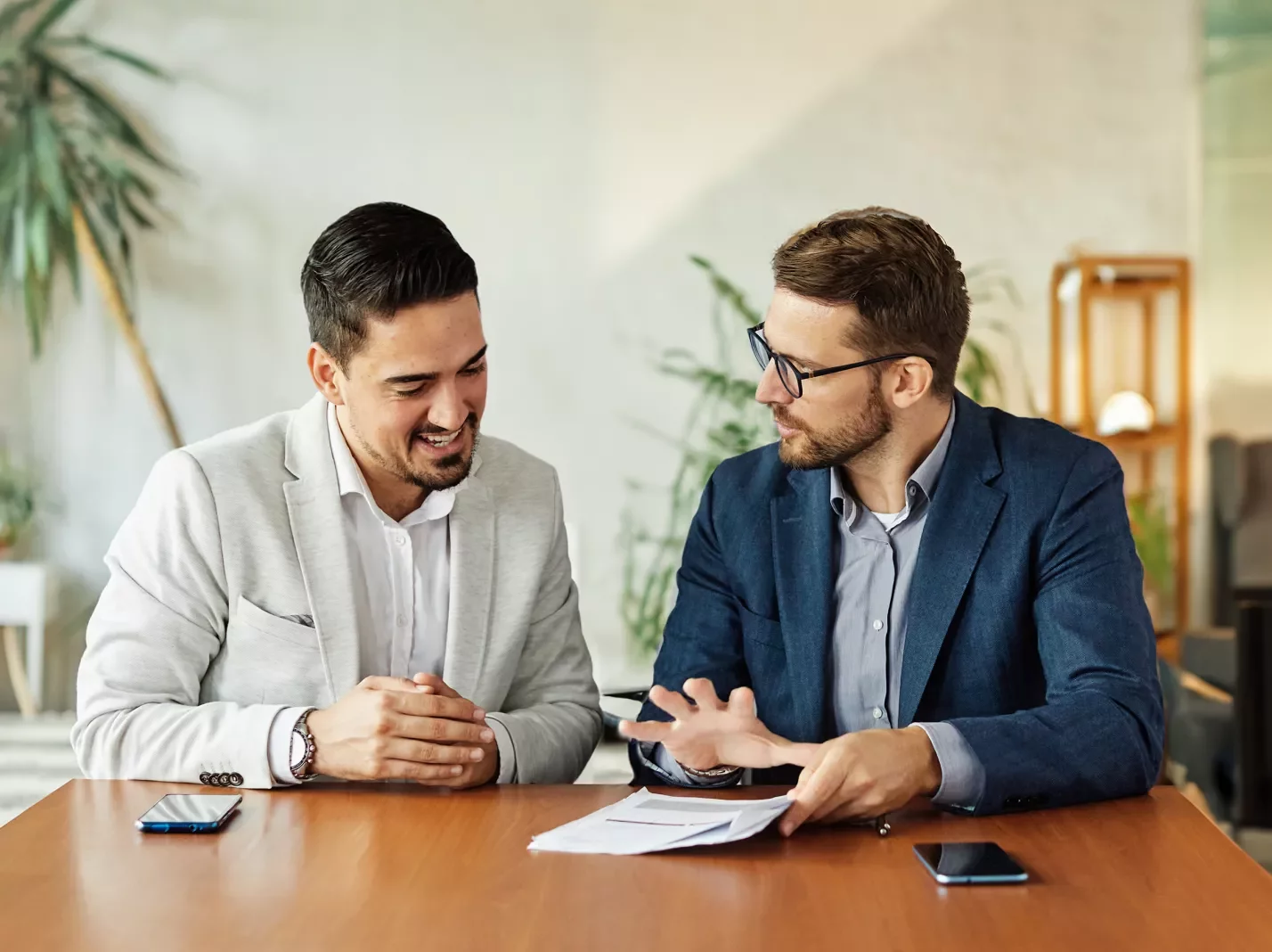 Two men working on a document