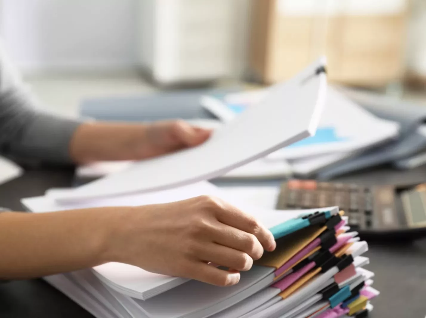 Hands sorting documents