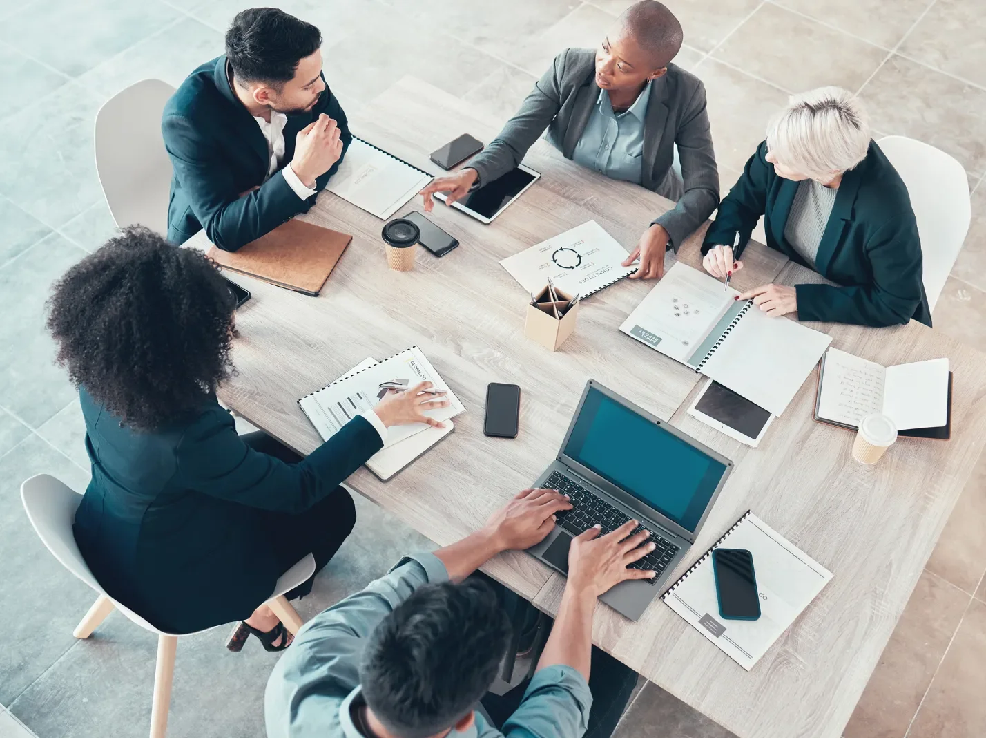 overhead view of a group of professionals seated around a table