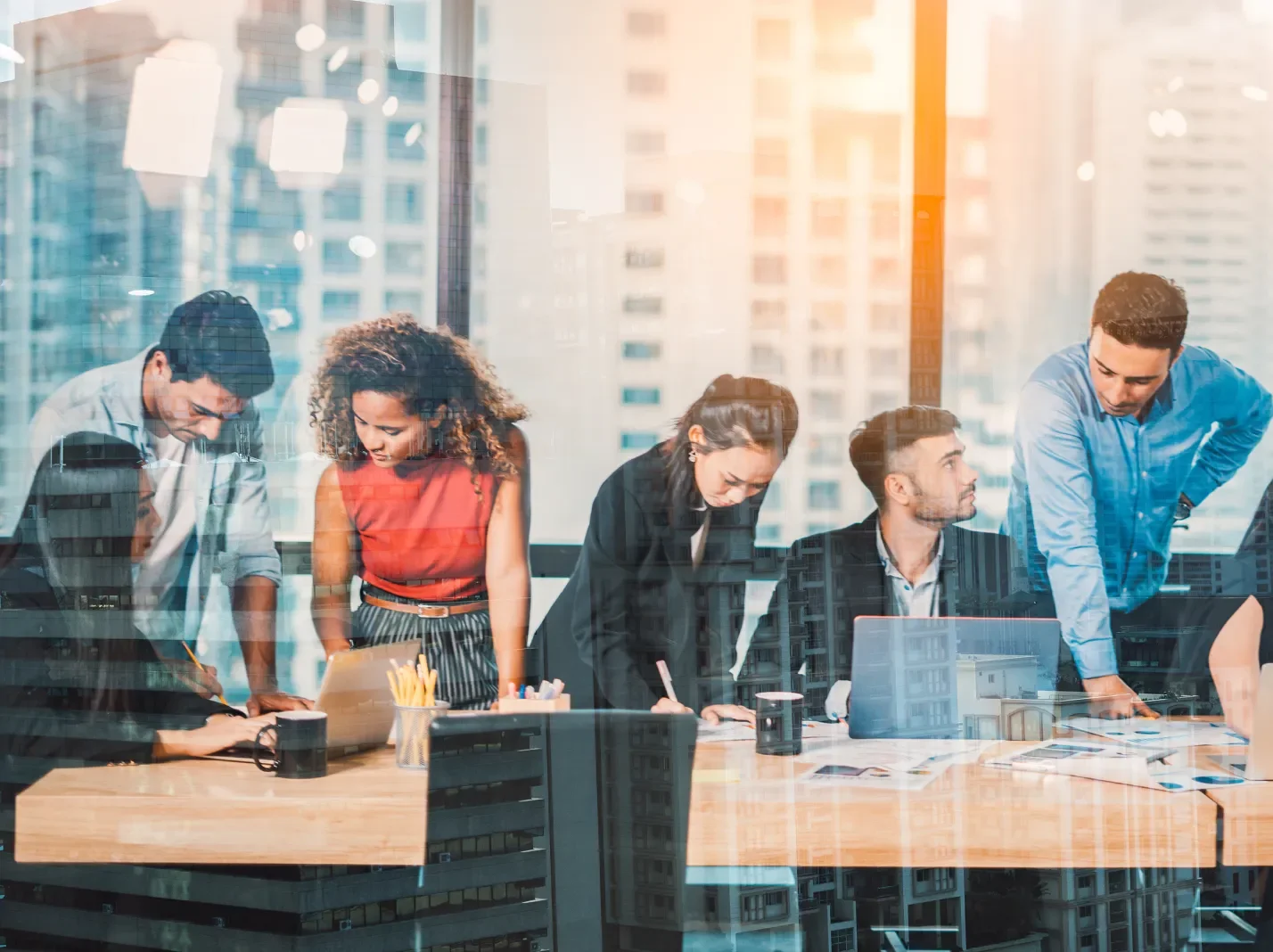 Diverse group of business professionals sitting at a conference table