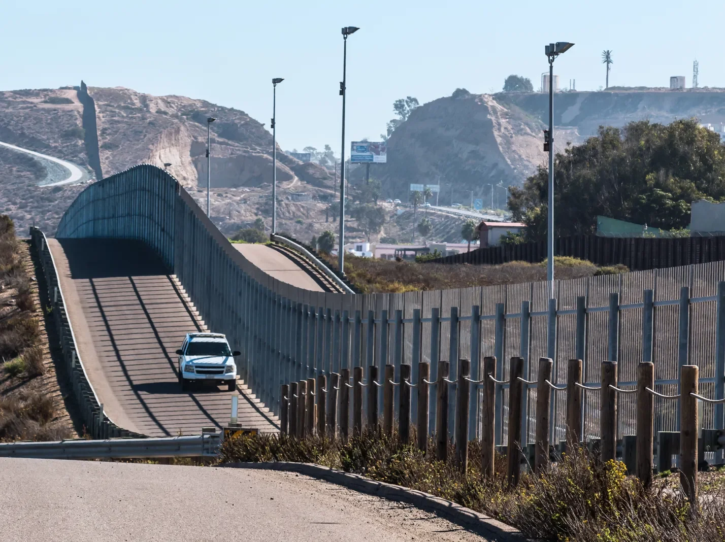 Road running along a border wall