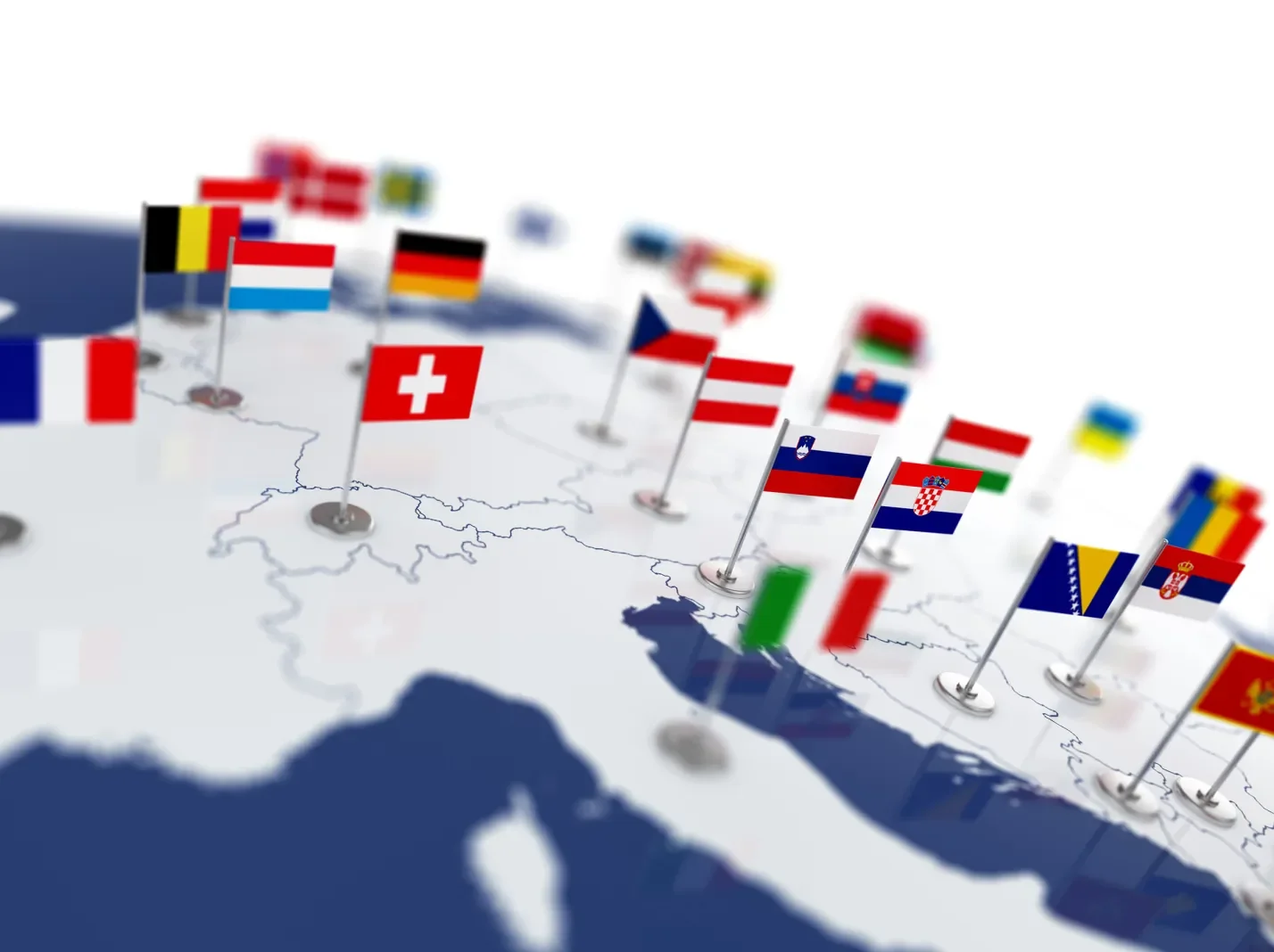 Colorful flags pinned over a map of Europe