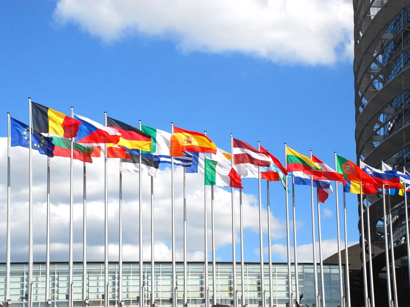 EU flags against a blue sky