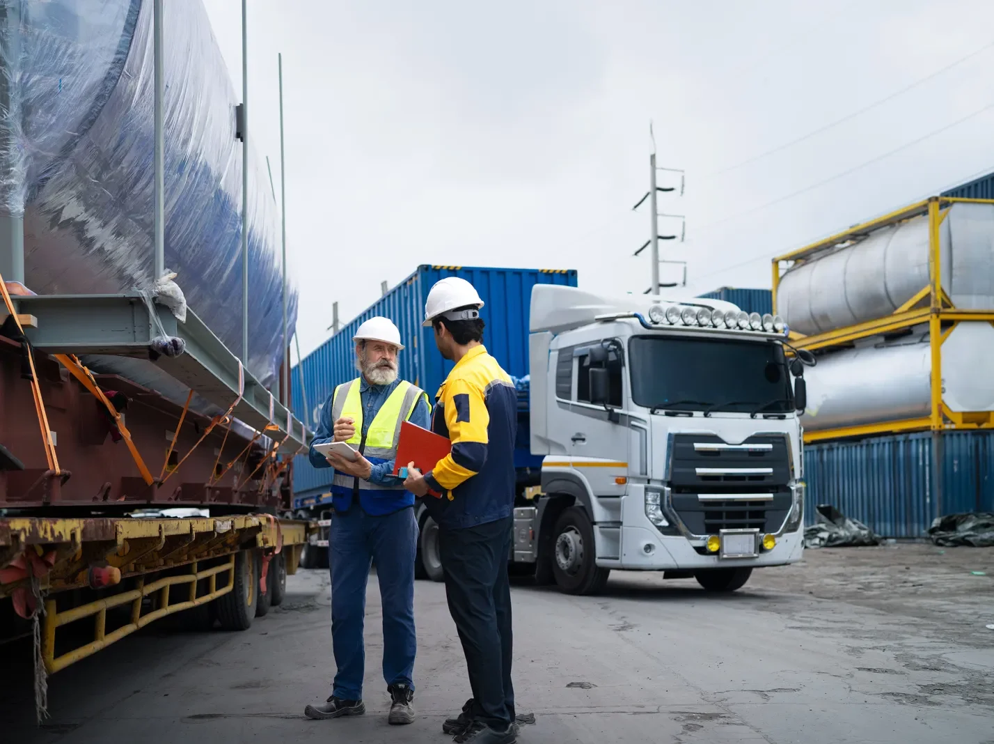 Transportation workers talking next to truck