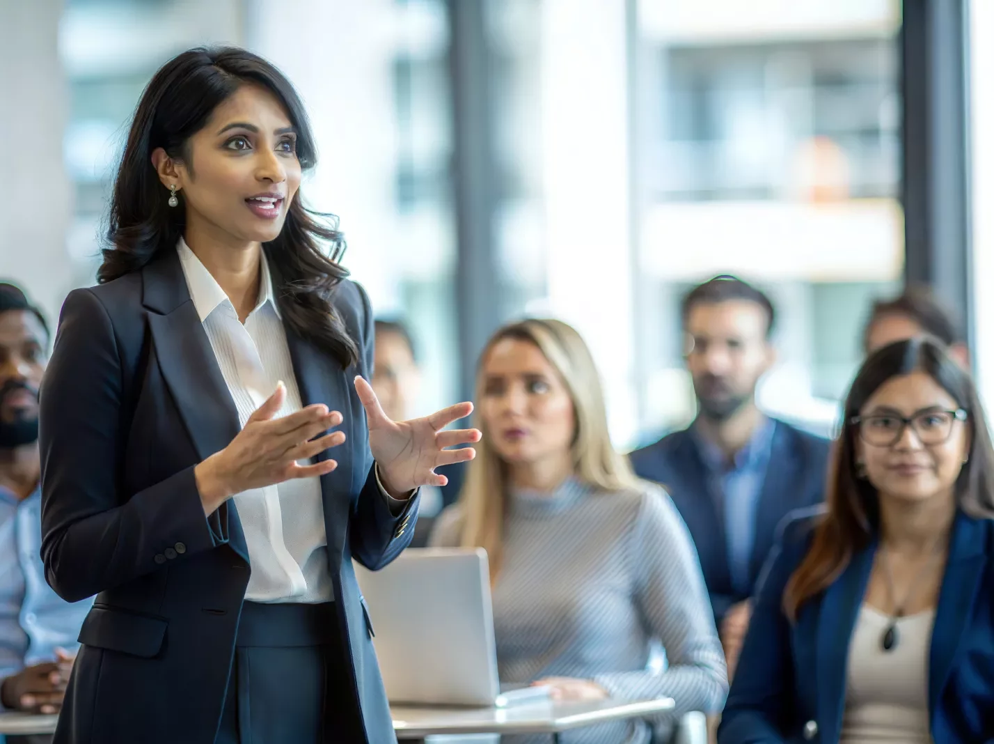 workplace training instructor speaking in a group setting with professionals