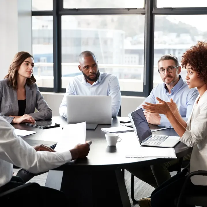 Project team seated around a table