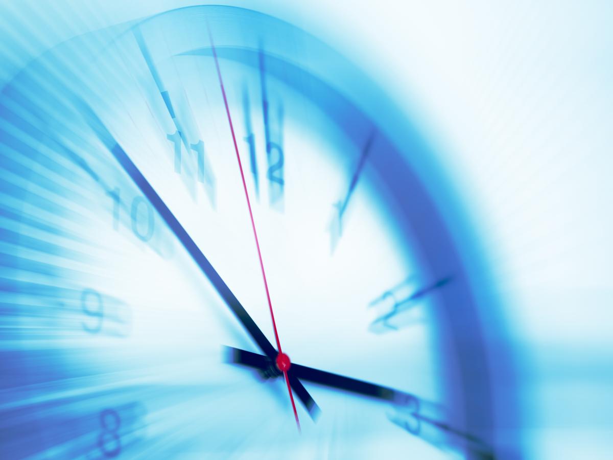 Wage and hour blurry clock image