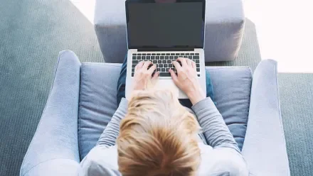 overhead view of a person looking at a laptop screen