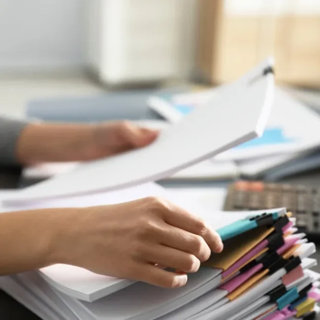 Hands sorting documents
